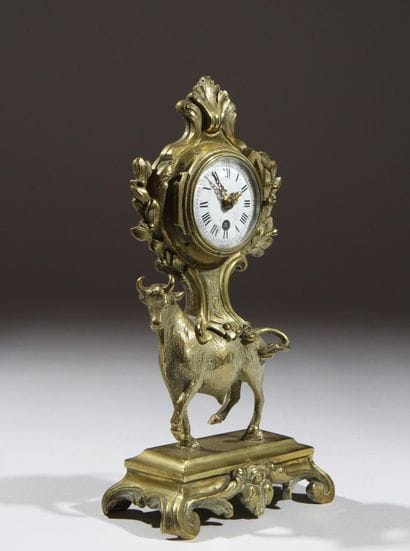 Gilded and chiseled bronze bull-shaped clock...