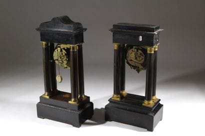 A pair of blackened wood-veneered portal...