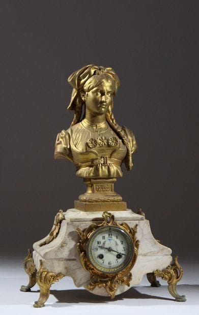 Four-legged marble and gilded metal clock...