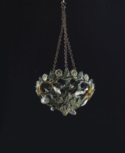 A basket-shaped hanging lamp made of glazed...