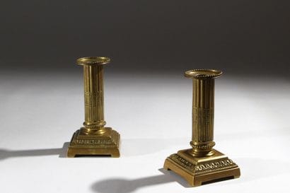 Pair of gilded bronze candlesticks, formerly...