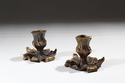 Pair of patinated bronze candlesticks with...