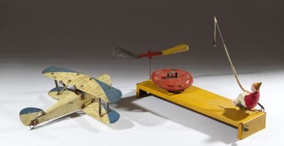 A set of two vintage lacquered tin toys:...