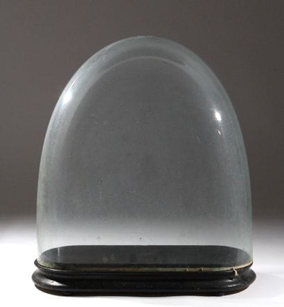 Large glass globe on a rectangular base made...