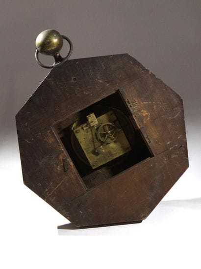 A wooden wall-mounted sign, known as an “ox-eye,”...