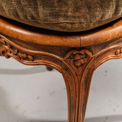 Cane-seated office chair made of molded and...