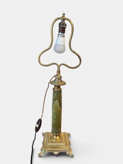 Torch mounted as a lamp with a green marble...