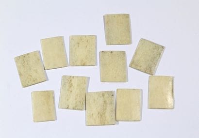 Set of eleven miniature playing cards made...