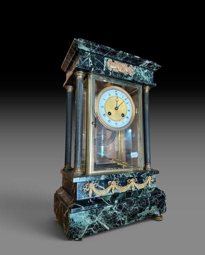 A portico clock made of sea-green marble,...