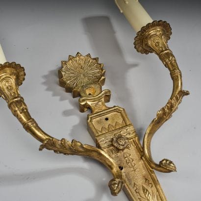 Two-light wall sconce in patinated, gilded,...