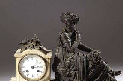 Bronze and white marble clock decorated with...