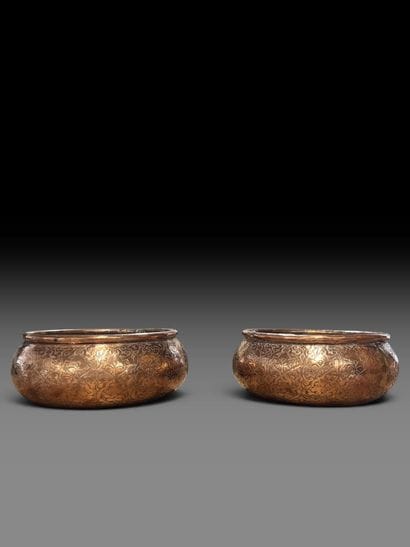 A pair of two circular copper-plated brass...