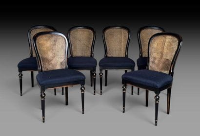 A set of six chairs made of black-painted...