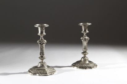 Pair of silver-plated, chiseled bronze candlesticks...