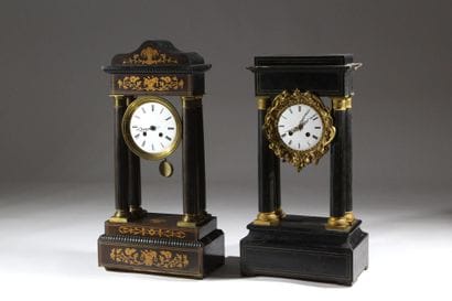 A pair of blackened wood-veneered portal...