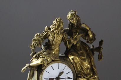 Romantic clock in chiseled and gilded bronze....
