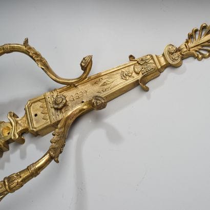 Two-light wall sconce in patinated, gilded,...