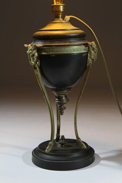Metal lamp with a dark patina and gilded...