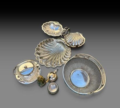 A set of silver plated metal pieces consisting...