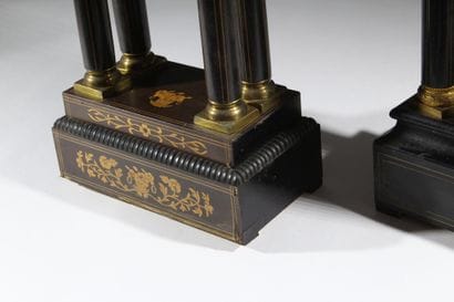 A pair of blackened wood-veneered portal...
