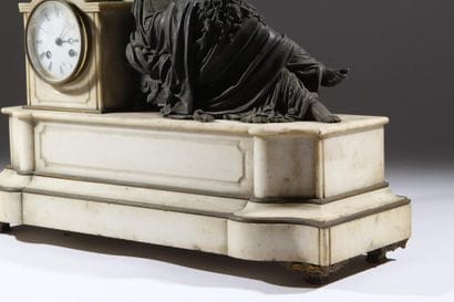 Bronze and white marble clock decorated with...