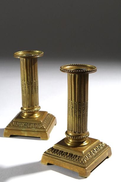 Pair of gilded bronze candlesticks, formerly...