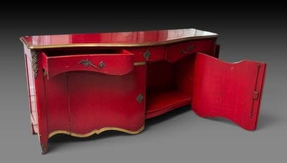A red-lacquered wooden sideboard with gold...