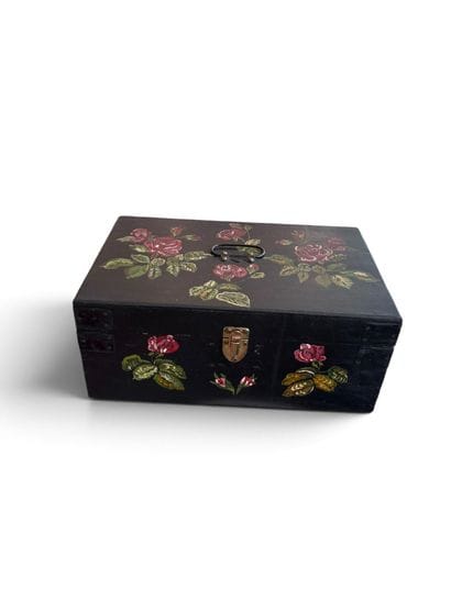 Small wooden chest painted with a rose design...