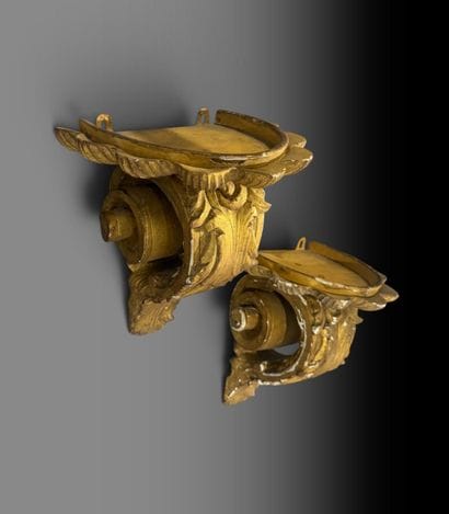 Pair of stuccoed and gilded wooden wall sconces...