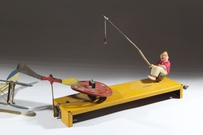 A set of two vintage lacquered tin toys:...