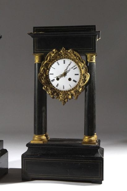A pair of blackened wood-veneered portal...