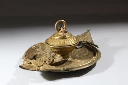 Bronze inkwell 
with rich decoration featuring...