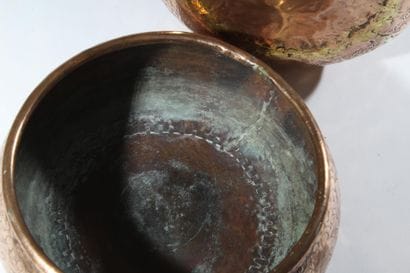 A pair of two circular copper-plated brass...