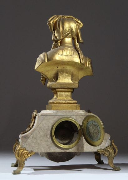 Four-legged marble and gilded metal clock...