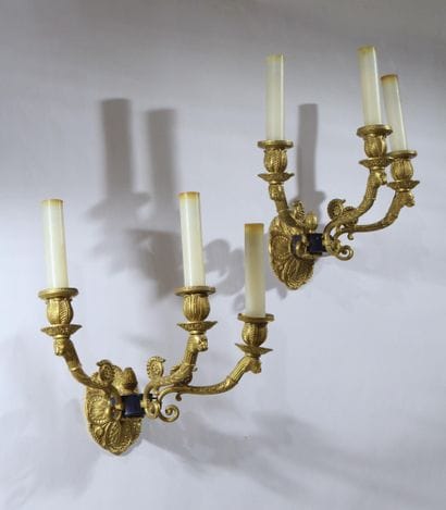 Pair of three-arm wall sconces in gilded,...