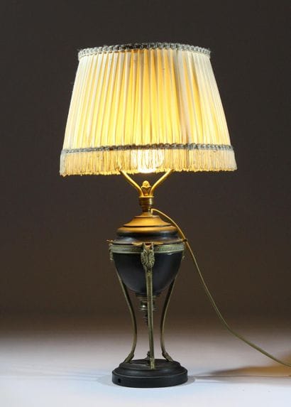 Metal lamp with a dark patina and gilded...
