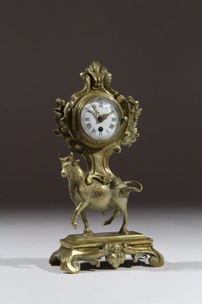 Gilded and chiseled bronze bull-shaped clock...