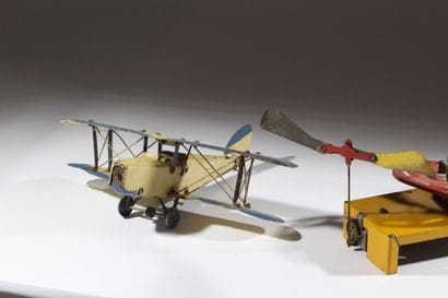 A set of two vintage lacquered tin toys:...