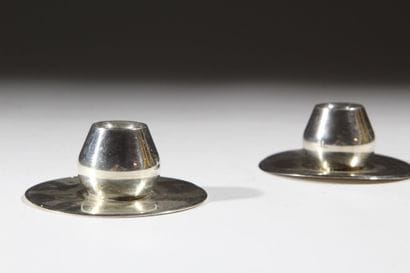 A pair of small modernist silver plated metal...