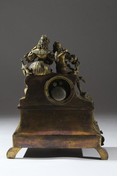 Romantic clock in chiseled and gilded bronze....