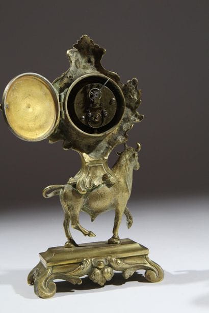 Gilded and chiseled bronze bull-shaped clock...