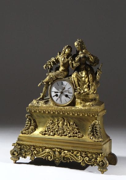 Romantic clock in chiseled and gilded bronze....