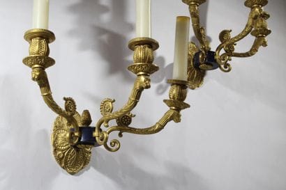 Pair of three-arm wall sconces in gilded,...