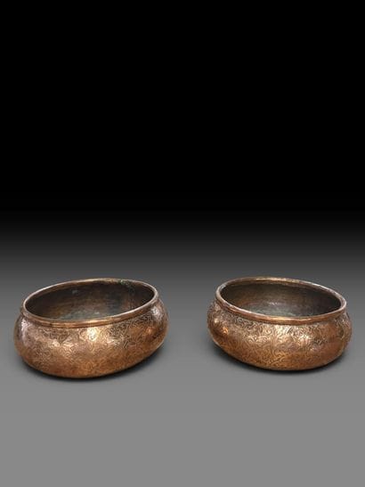 A pair of two circular copper-plated brass...