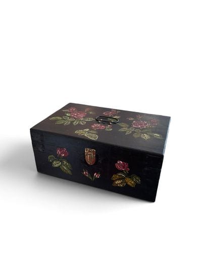 Small wooden chest painted with a rose design...