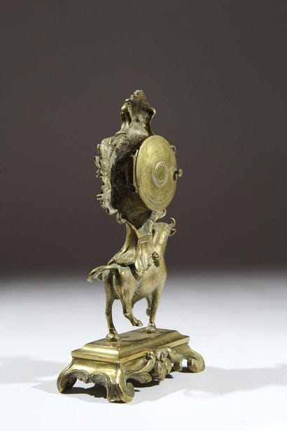 Gilded and chiseled bronze bull-shaped clock...