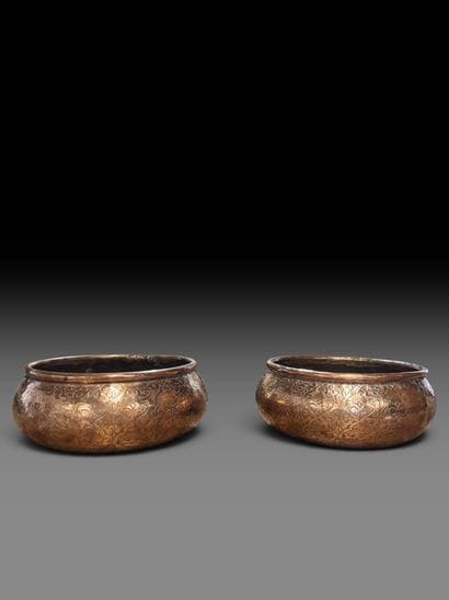 A pair of two circular copper-plated brass...