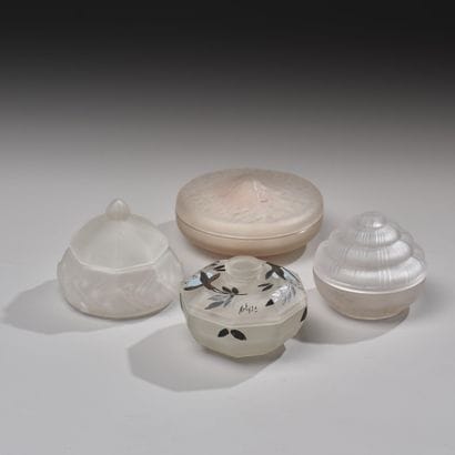 Reunion of four pressed glass poudriers including...