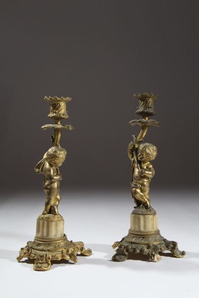 Pair of gilded bronze candlesticks, chiseled...
