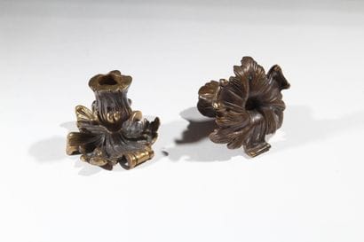 Pair of patinated bronze candlesticks with...